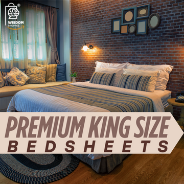 Cozy bedroom with a premium king size bedsheet, layered pillows, and striped blanket, set against a brick accent wall and soft lighting.